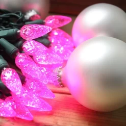 50-light C6 Pink LED Christmas Lights, 4" Spacing Green Wire -Christmas Light Store c6 pink led christmas lights 11618