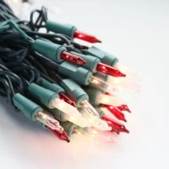 100-bulb Candy Cane (Red Clear Frost) Mini Lights, 4" Spacing, Green Wire 10 100-bulb Candy Cane (Red Clear Frost) Mini Lights, 4" Spacing, Green Wire -Christmas Light Store red clear white frost glass mini lights green wire b